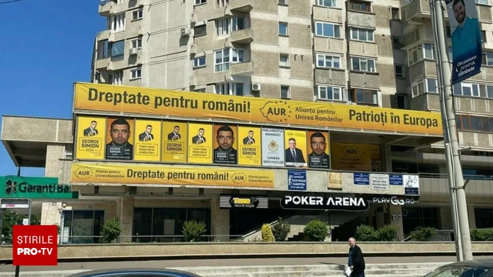 „O sfidare neruşinată” . BEC obligă AUR să înlăture afișele electorale de pe ferestrele sediului din Iași