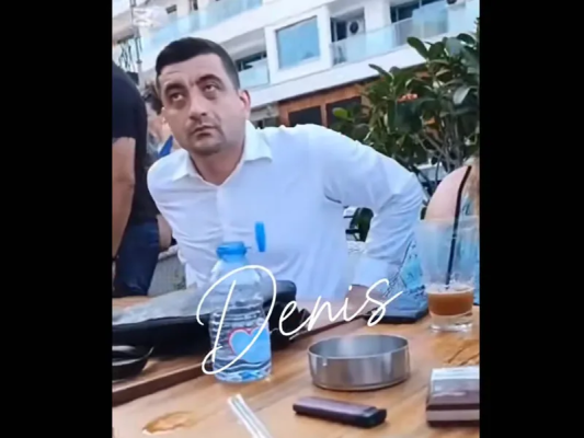 VIDEO George Simion se relaxa la terasă în Cipru când fanii AUR se băteau cu jandarmii în București