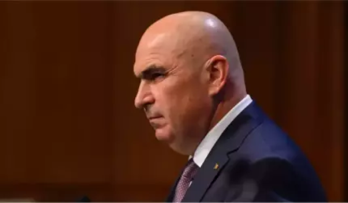 Surse - Bolojan taie banii şi pentru deplasările externe ale Guvernului: mai puţine şi mai mici